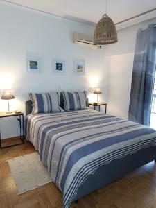 Ένα ή περισσότερα κρεβάτια σε δωμάτιο στο Elegant Renovated 3-bedroom appartment in Maroussi