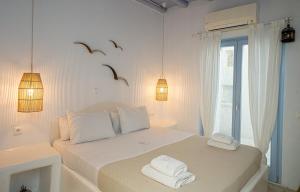Postel nebo postele na pokoji v ubytování BLUE DAISY House, Ornos, by MyconBay Mykonos + 37 fotografií