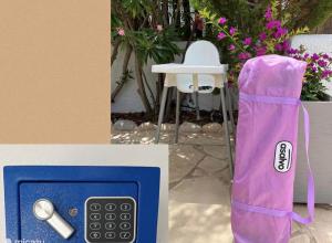 a purple bag sitting next to a table and a chair at Casa Verano - Moraira in Moraira