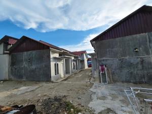 a row of houses are being constructed at HOMESTAY PANDAN in Halangan +10 photos