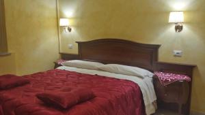 Postel nebo postele na pokoji v ubytování 3 Lati di Pitagora B&B