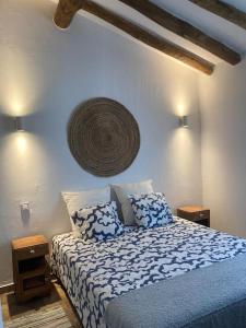 a bedroom with a bed with two pillows on it at Casa do Monte T2 - Esperança in Arronches +31 photos