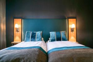 Postel nebo postele na pokoji v ubytování Quality Hotel Grand Steinkjer