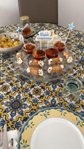 a table with cupcakes and a plate of food on it at Belvedere Valle Mare in San Leone