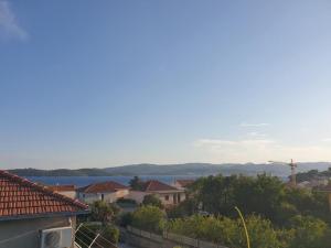 a view of a town with houses and a lake at Apartment LoLi in Orebić