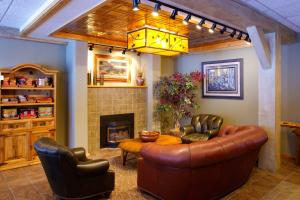a living room with a couch and a fireplace at Togwotee Mountain Lodge in Moran