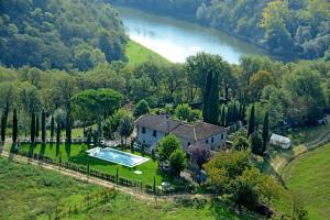 an aerial view of a house with a swimming pool at Podere Buriano in Arezzo