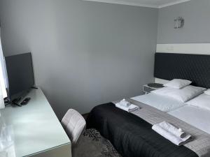 Posteľ alebo postele v izbe v ubytovaní Apartament Lazur