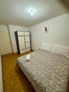 a bedroom with a bed in a room at La Maison de Voyage in Lausanne