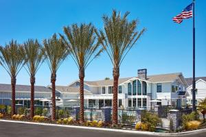 a row of palm trees in front of a building at Residence Inn Los Angeles LAX/Manhattan Beach in Manhattan Beach