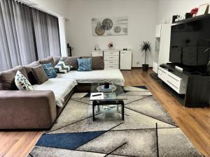 a living room with a couch and a table at Wohnung 51 in Oberwesel
