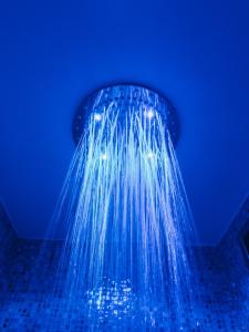 a shower with blue lighting in a bathroom at Tenuta il Laureto in Arpino