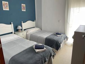 Posteľ alebo postele v izbe v ubytovaní Apartamento playa Valdelagrana