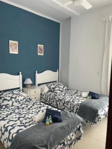 Posteľ alebo postele v izbe v ubytovaní Apartamento playa Valdelagrana