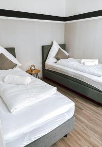 Postel nebo postele na pokoji v ubytování DoreyHome P6 I Modern flat ruhige Lage I 11 Personen