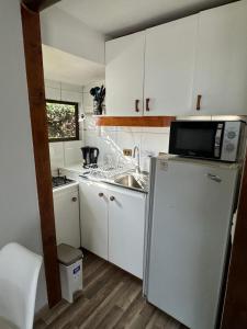 Η κουζίνα ή μικρή κουζίνα στο Frente al mar