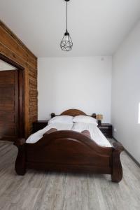 Posteľ alebo postele v izbe v ubytovaní Apartamenty pod Kicarzem