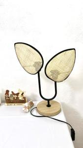 a lamp sitting on top of a table at Chambre Djaou meublée Voidjou in Batsa