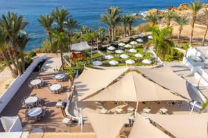 an aerial view of a resort with the ocean at Queens Bay Hotel in Paphos