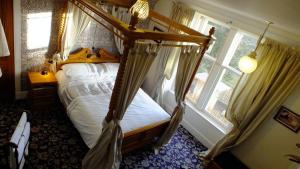 Postel nebo postele na pokoji v ubytování Greystones B&B