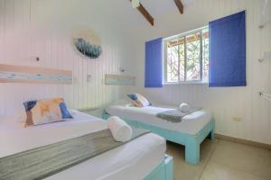 Postel nebo postele na pokoji v ubytování Boho lodge Montezuma l&l + 37 fotografií