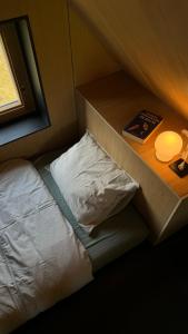 Voodi või voodid majutusasutuse Origine Tiny House toas