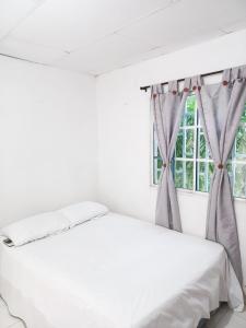 Postel nebo postele na pokoji v ubytování Hostal oasis