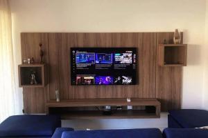 TV a/nebo společenská místnost v ubytování Ykutiba -apt F001 térreo vista parcial mar