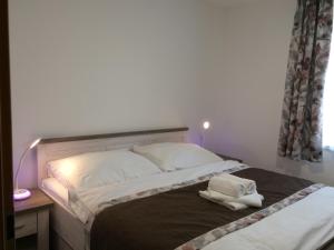 Postel nebo postele na pokoji v ubytování Apollon resort A3