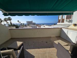 A balcony or terrace at Los Gigantes Amazing Sea view WiFi Pool Parking