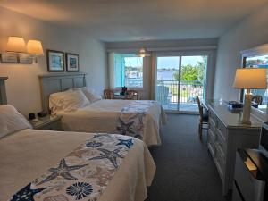 Voodi või voodid majutusasutuse The Ocracoke Harbor Inn toas