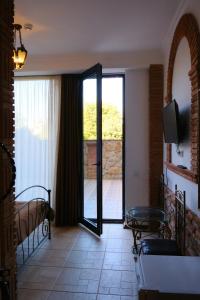 A television and/or entertainment centre at Janashia Boutique Hotels