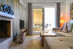 a living room with a couch and a fireplace at Premium Athenian District Urban 1 bedroom flat C in Athens