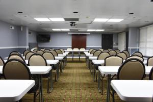 a room with rows of tables and chairs at Days Inn by Wyndham Lebanon in Lebanon +14 photos