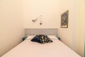Letto o letti in una camera di Windrose Risorgimento Suite