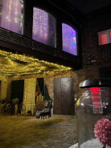 a building with lights on it with a swing at wySPAne Katowice in Katowice +25 photos