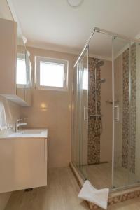 a bathroom with a shower and a sink at Villa Ragusa Vecchia in Dubrovnik