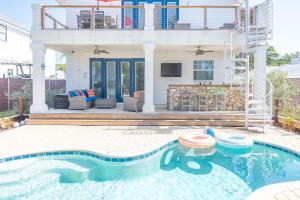 a house with a swimming pool in front of a house at 4BD 3BR Pool Paradise 1 mile from Beach & Downtown in Saint Augustine