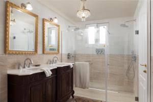 a bathroom with a sink and a shower at Villa Vendelina in Podgora +39 photos