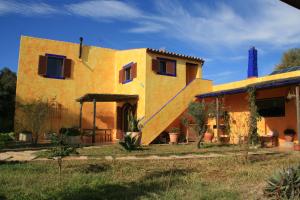 a house with a staircase in front of it at El Vuelo de la Libélula in Barbate