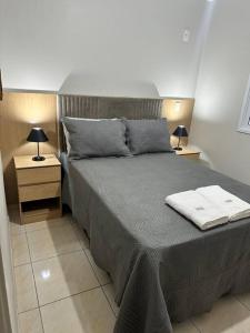 Postel nebo postele na pokoji v ubytování Charmoso apartamento na terra do Talian!