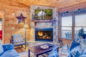 a living room with a fireplace in a cabin at Secluded Sunrise Ridge-10 Min From Blue Ridge, King Beds, Hot Tub, 2 Porches, Fireplace Wood Burning, Mountain View, Cozy in Blue Ridge