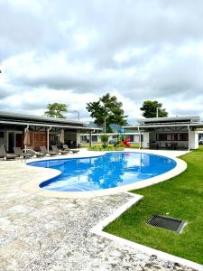a swimming pool in the yard of a house at Viva Jaco 9-05 in Jacó