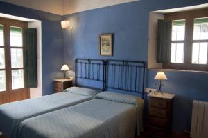 מיטה או מיטות בחדר ב-Molino El Vinculo
