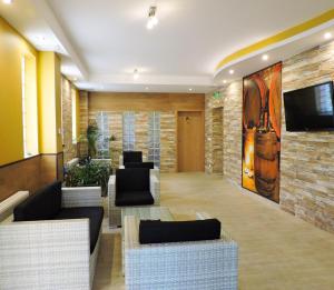 TV a/nebo společenská místnost v ubytování Alpe-Adria Apartments