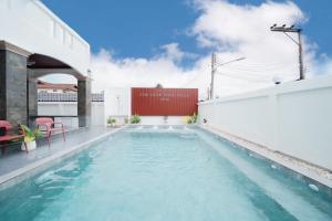 a swimming pool on the roof of a building at The Star Pool Villa Hatyai in Hat Yai +37 photos