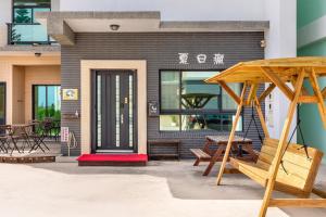 a building with a playground in front of it at Summer Crazy in Huxi