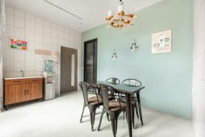 a kitchen and dining room with a table and chairs at Summer Crazy in Huxi +57 photos