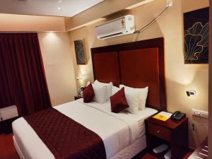 Postel nebo postele na pokoji v ubytování Park Avenue Hotel & Apartments Trichy