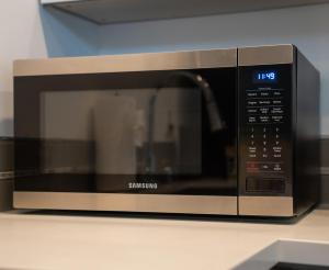 a microwave oven sitting on top of a counter at Explore Seattle Free Parking & Walk to Light Rail - New listing & ABNB Superhost in Seattle +13 photos